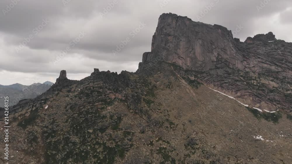 Flying over the mountain gorge in the Siberian nature Park Ergaki. Drone shot. Flying over the mountain gorge in the Siberian nature Park Ergaki. Drone shot.