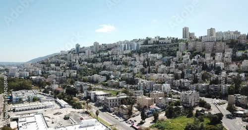 Aerial footage of Haifa City down town in summer time, with a beautiful Modern glass building. photo