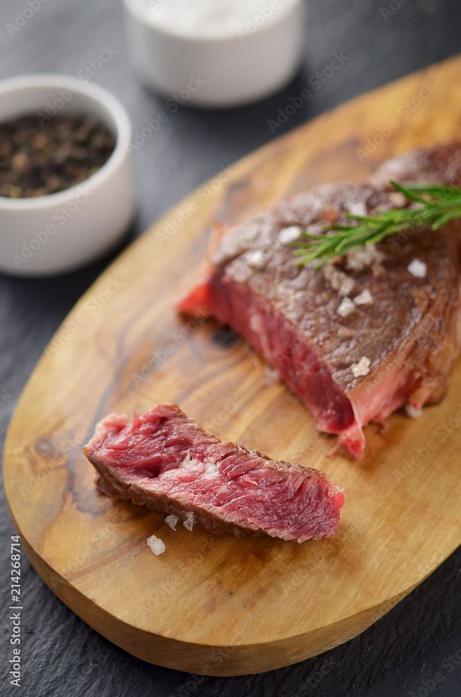 Grilled juicy steak with rosemary. top view
Grilled juicy steak with rosemary. top view