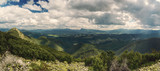 Carpathian mountains summer landscape with dramatic clouds and mossy stones. Panoramic view