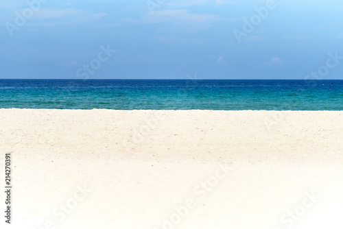 White sand, deep blue sea and the sky on sunny day with copy space