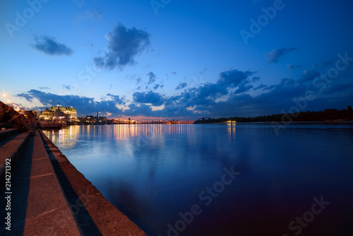 Havana bridge in Kiev at night with colorful illumination, beautiful clouds and reflection in Dnieper river. Wide angle