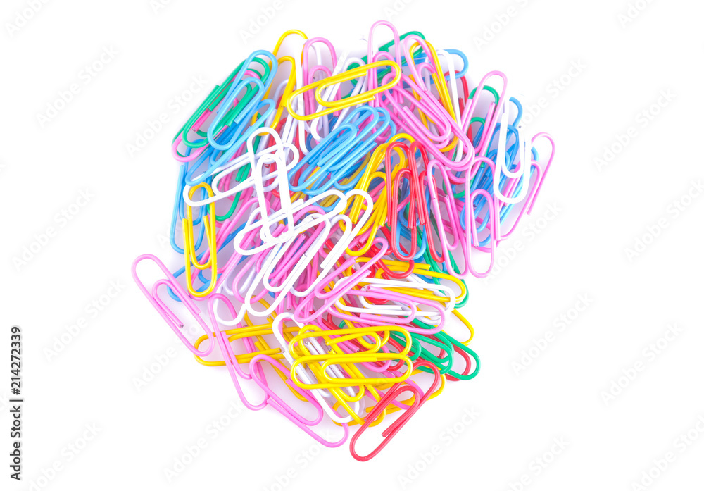 Fototapeta premium A lot of colored paper clips on a white isolated background. School supplies. Stationery.