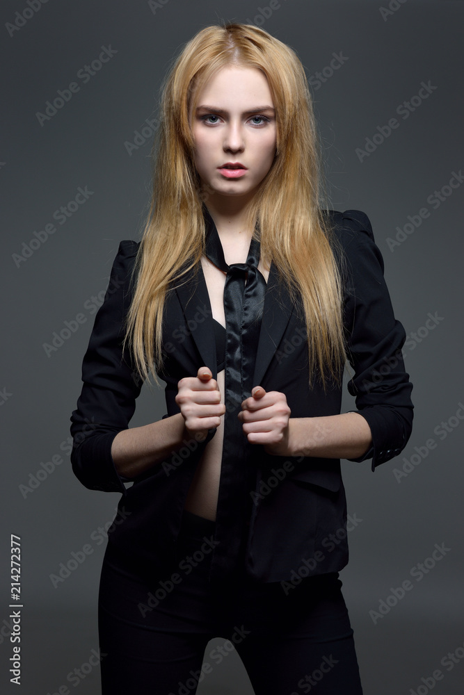 Sexy woman with red hair in black clothes Sexy woman with red hair in black clothes