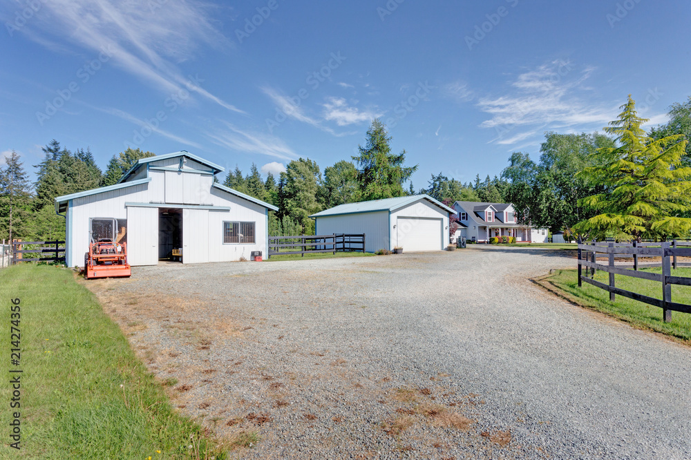 View of wide driveway to detached garages. View of wide driveway to detached garages.