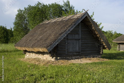 Ancient Belarusian (Russian) village, wooden cellar with authentic roof © Drozd Dmitriy