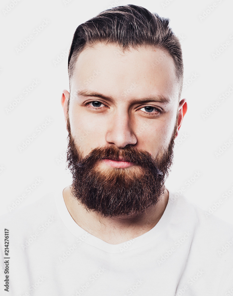 Young bearded man over white background. Lifestyle and people concept. Young bearded man over white background. Lifestyle and people concept.