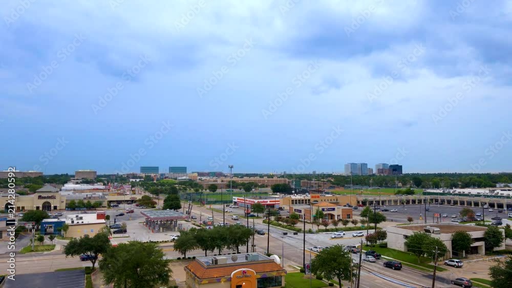 Houston Texas suburban street in 4K with cars driving around as dark clouds cover the area. Houston Texas suburban street in 4K with cars driving around as dark clouds cover the area.