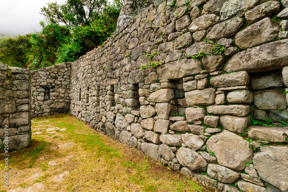 Inca ruins between Machu Picchu and Intipunku (Sun Gate) Inca ruins between Machu Picchu and Intipunku (Sun Gate)