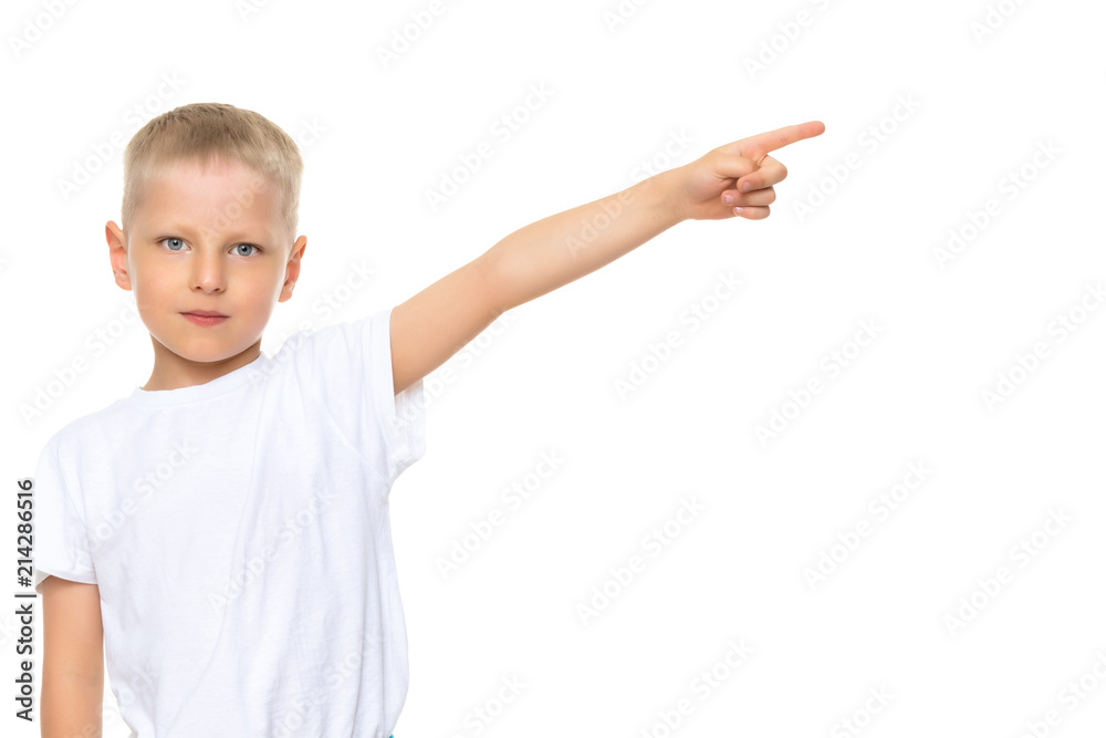 A little boy in a pure white T-shirt is pointing at something. A little boy in a pure white T-shirt is pointing at something.