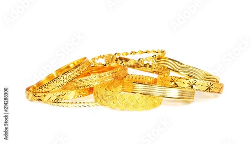 Gold bracelets on white