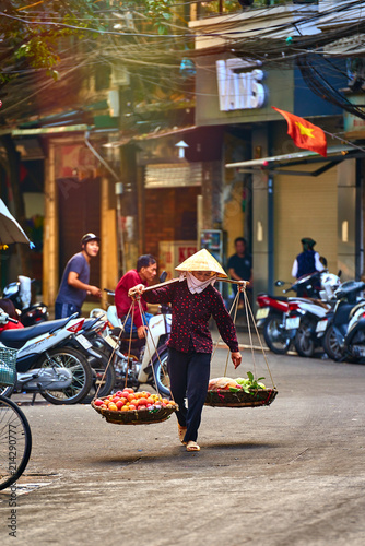 Hanoi, Vietnam-29 November 2014:Unidentified vendor at a market in Hanoi city.Vietnamese vendors with basket . Life in Vietnam