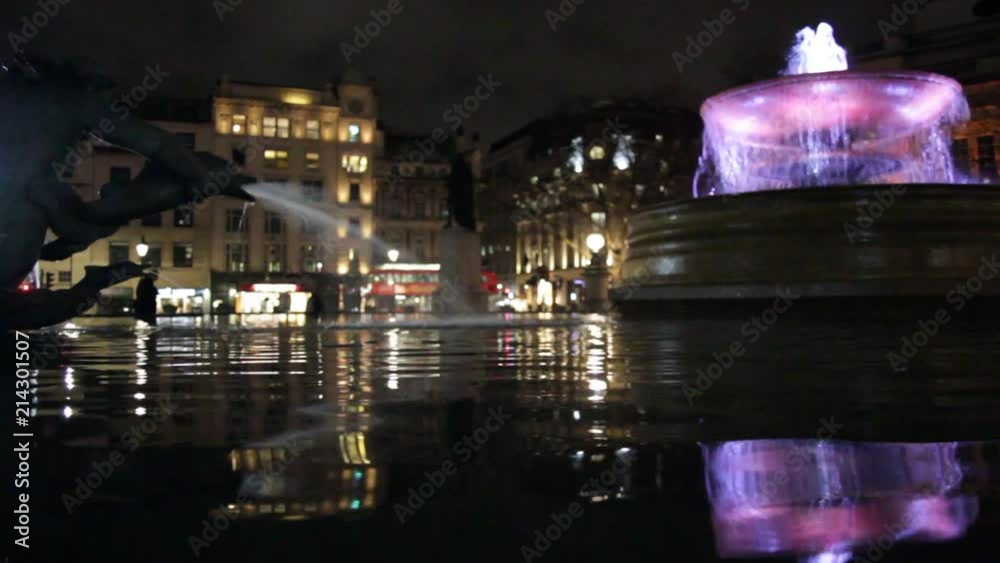 LONDON, Trafalgar Square at night fountains with bright lights real time tourism landmark LONDON, Trafalgar Square at night fountains with bright lights real time tourism landmark
