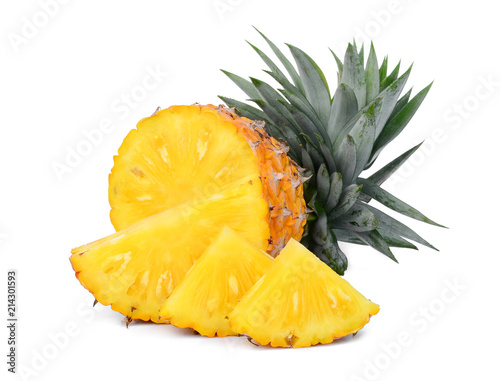half and slices ripe pineapple with leaves isolated on white background