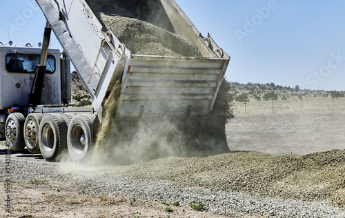 Dump Truck spreading Gravel on Driveway