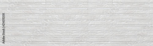 Panorama of Modern white stone tile wall pattern and seamless background