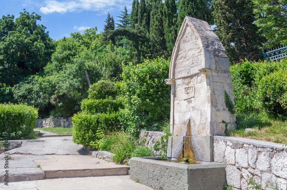 Russia, the Republic of Crimea, the city of Alupka. 06/09/2018: Fountain at the entrance to Vorontsov Park Russia, the Republic of Crimea, the city of Alupka. 06/09/2018: Fountain at the entrance to Vorontsov Park