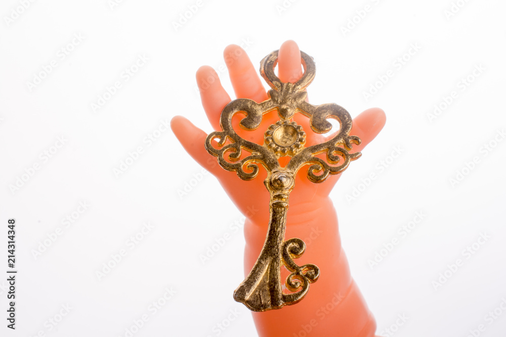 Doll holding a key