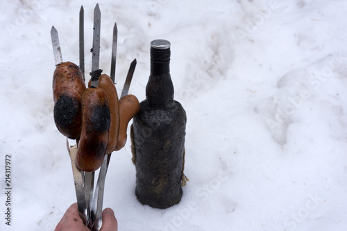 Fried meat sausages were not Used to cook juicy hunting sausages on the coals. Grilled sausages on the coals. Delicious grilled sausages . photo