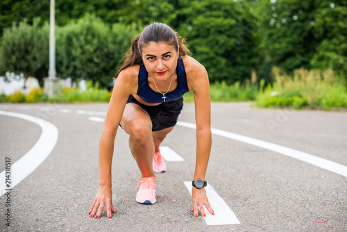 Concept of sports woman. Girl training outdoor, fit lifestyle. Modern life of young lady 