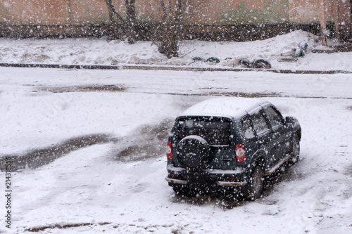 the cars on the parking under snow . photo