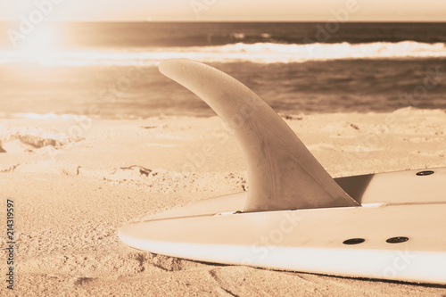 The surfboard with long fin tone effect on the beach sand in sunny day in Sunshine Coast Australia