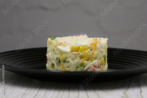 Salad with crab sticks, corn and eggs . © baon