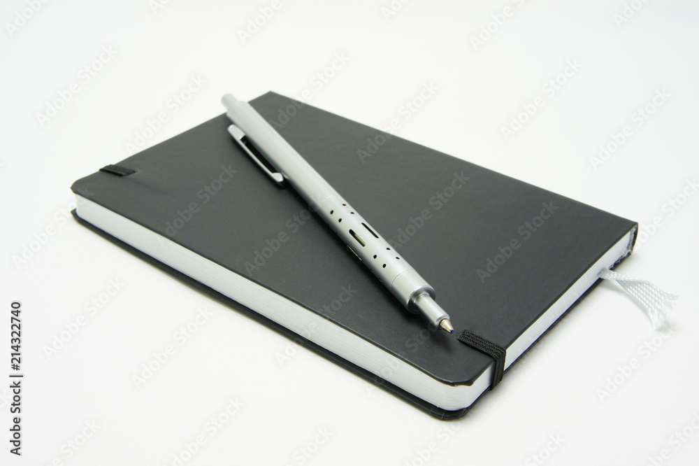 Pen of metal on a black notebook. Pen of metal on a black notebook.