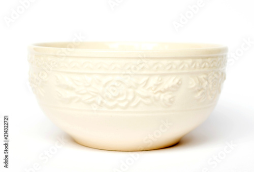 Empty vintage bowl isolated on white background; floral pattern and texture