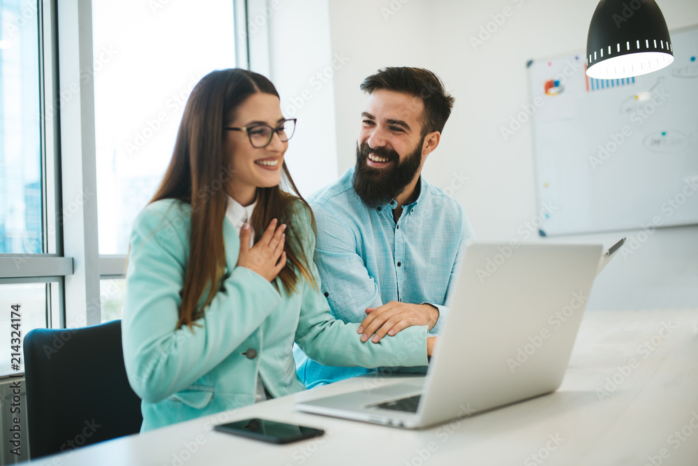 Successful businessmen in the office. Teamwork is easier for two. Young business people are doing a job that they love and are happy about it. Successful businessmen in the office. Teamwork is easier for two. Young business people are doing a job that they love and are happy about it.