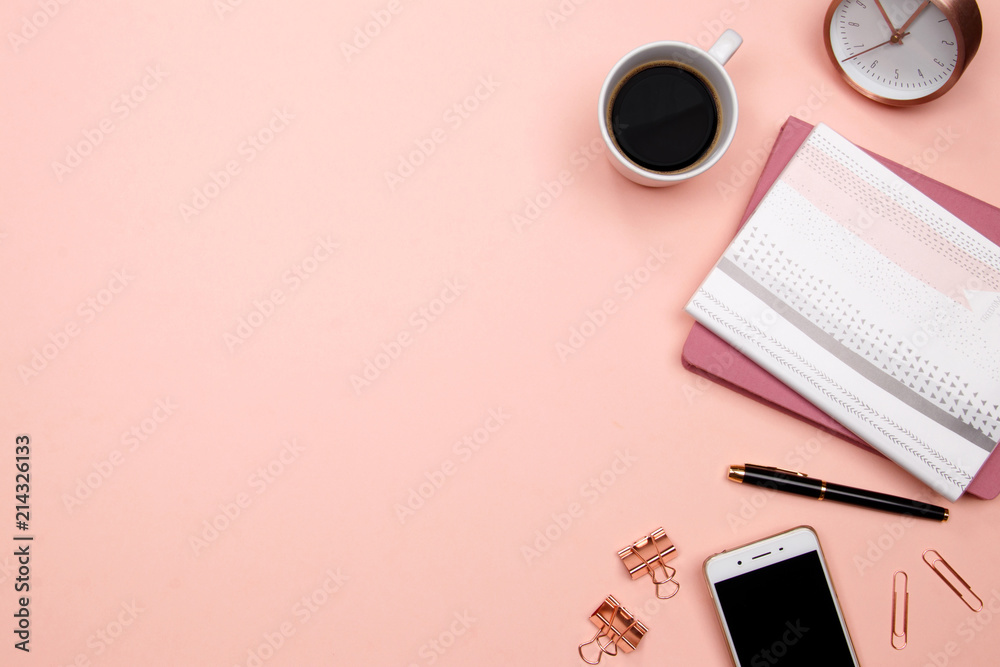 Office table desk with smartphone and other office supplies on pink background. Top view with copy space, flat lay. Office table desk with smartphone and other office supplies on pink background. Top view with copy space, flat lay.