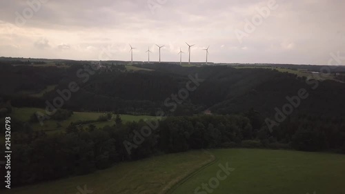 Top view of windmills, gifts from nature, ecology. Schleiden, Germany, Europe. Fields and forests, fantasy