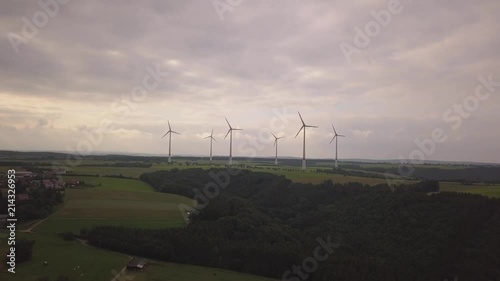 Fantastic view from above on windmills, gifts from nature, ecology. Schleiden, Germany, Europe. Fields and forests