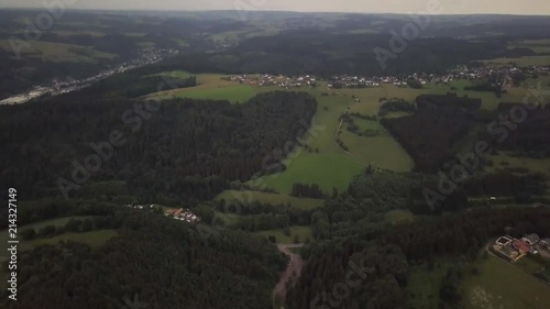  Incredible view from the sky to a small settlement of Schleiden in Germany Europe. Local architecture and boundless fields and forests