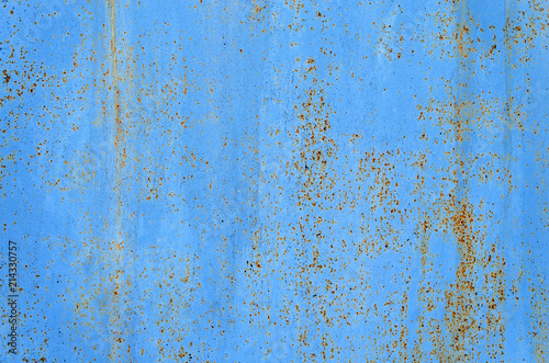 Blue rusty metal background with abstract texture. Old vintage scratches paint splats iron surface. Abstract background.