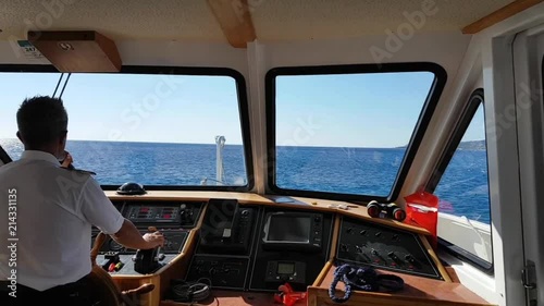 ship cockpit and commander talking to the microphone
