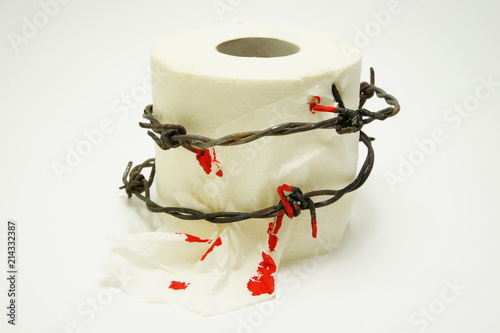 Acute hemorrhoids. Toilet paper with barbed wire and blood.