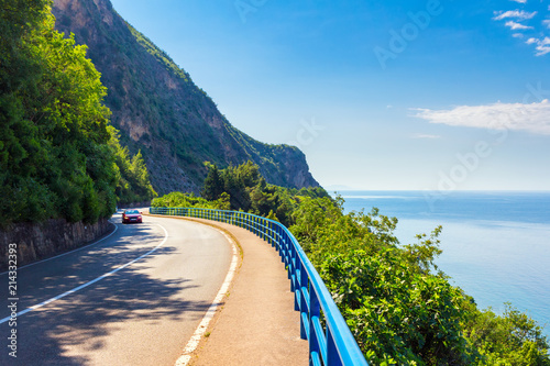Wall Mural Asphalt curved road with car on the Adriatic sea coastline at Montenegro, vacati