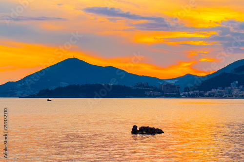 Fototapeta Naklejka Na Ścianę i Meble -  Awesome gold colored sunset on the Adriatic sea coastline in Montenegro, gorgeous seascape