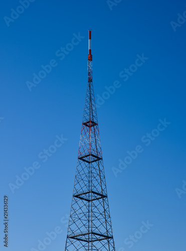 Leipzig / Germany: View to the red and white GRP-sheathed antenna on the top of the 191 meter high steel truss radio tower