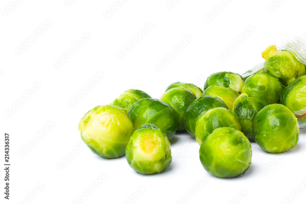 Plastic bag with frozen brussel sprouts isolated on white. Vegetable preservation Plastic bag with frozen brussel sprouts isolated on white. Vegetable preservation