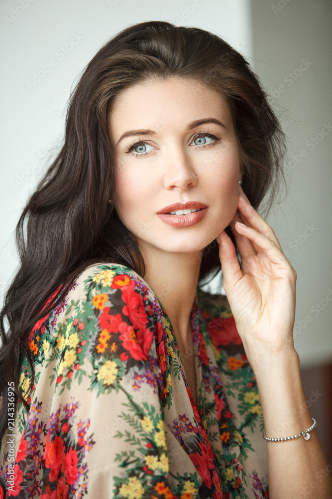 Close-up portrait of an attractive young woman. Brunette with blue eyes. Close-up portrait of an attractive young woman. Brunette with blue eyes.