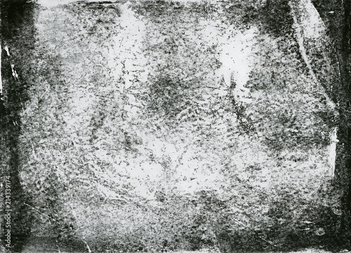 A high resolution scan of a black and white distressed lino print texture. Ideal for use as a background texture or for applying an aged or vintage effect to graphics.