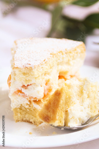 Cake with cream and oranges