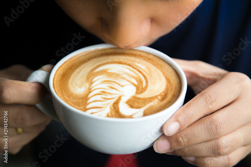 People drinking hot coffee, art latte coffee.
