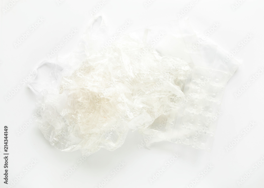 Heap of plastic garbage: bags, containers for recycling on white background. Top view