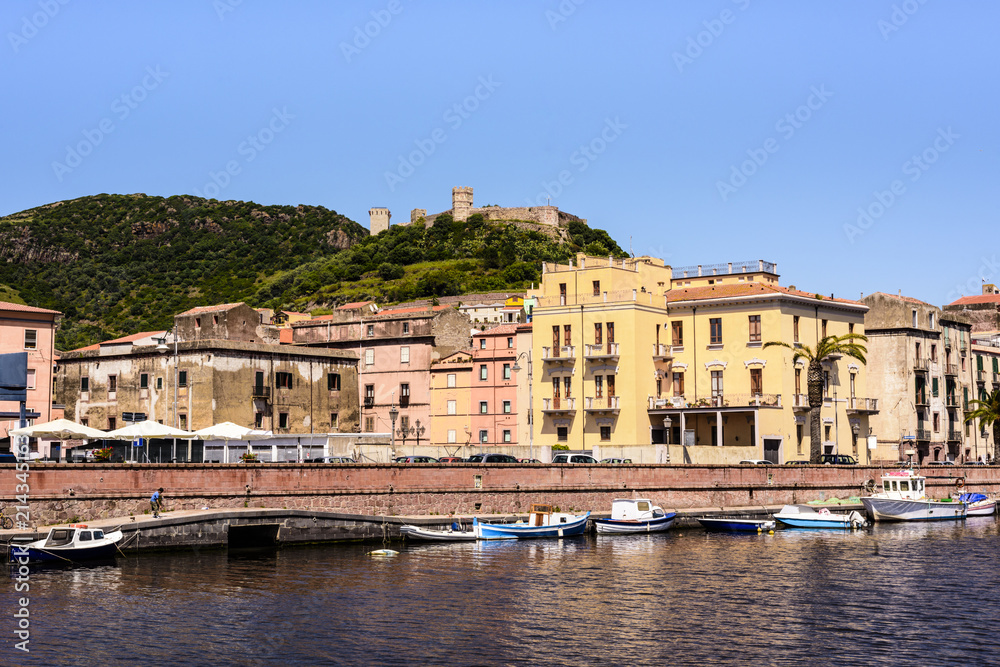 Mediterranean houses and Serravalle's castle on the shore of Tremo River in beautiful Bosa, Sardinia, Italy