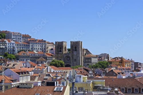 The view of the city from view point. The roofs of the houses. The Lisbon Cathedral Santa Maria Maior de Lisboa or Se de Lisboa. Portugal.