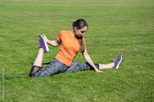 girl doing warm up before training photo