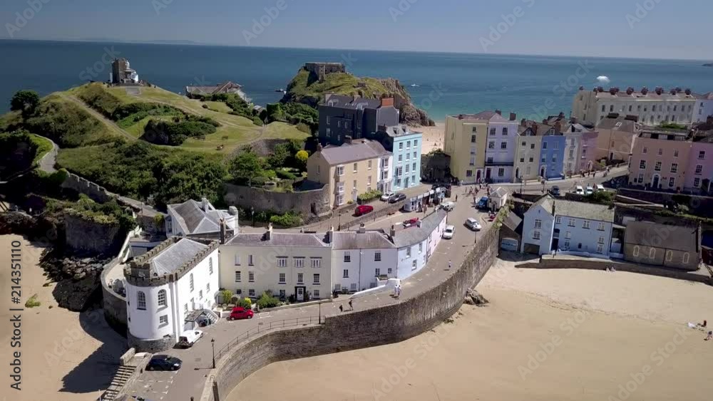 Aerial drone view of the historic Welsh seaside town of Tenby and its twin sandy beaches and medieval fort